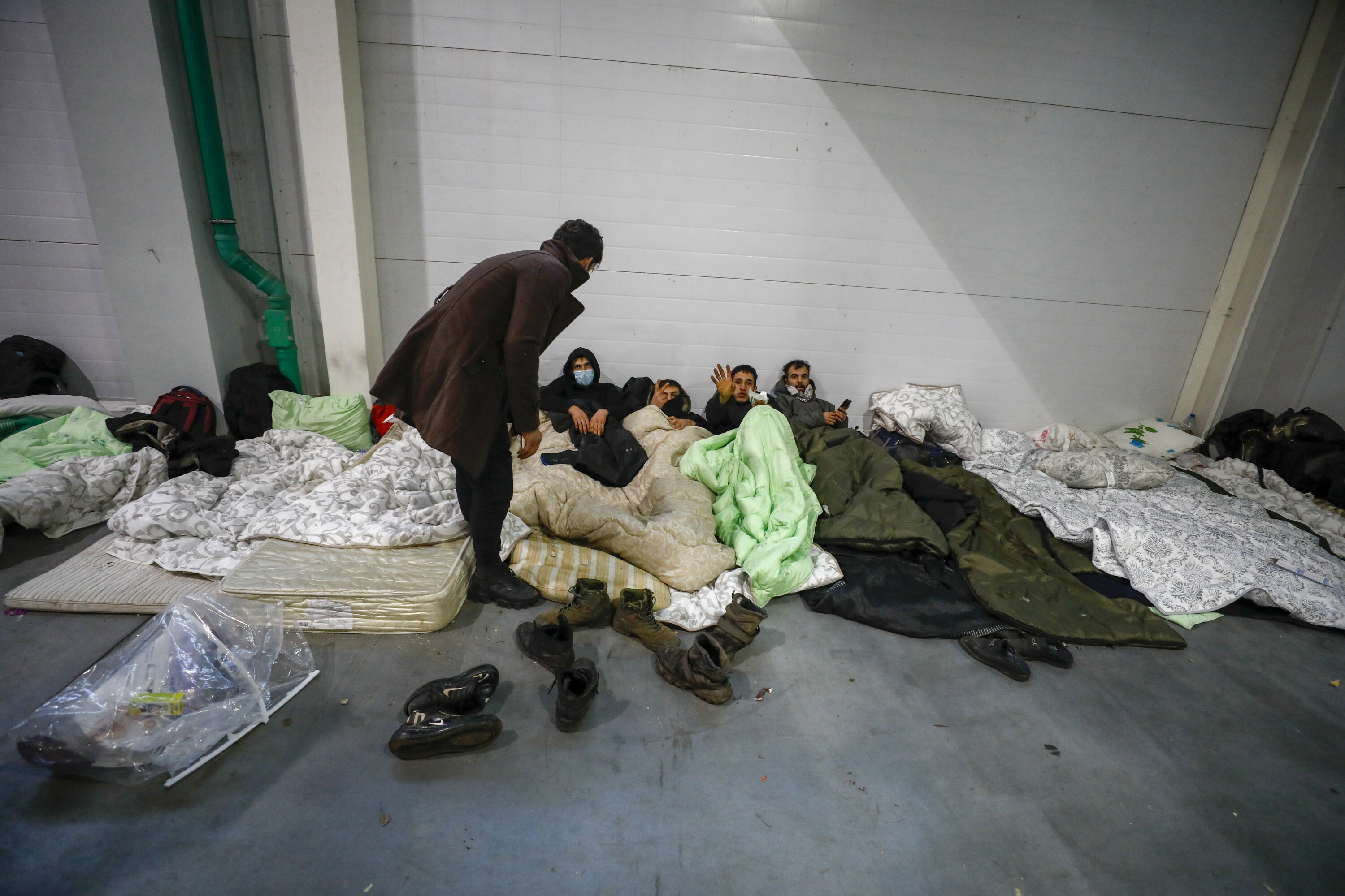 Belarus gov't moves migrants at Polish border to heated warehouse