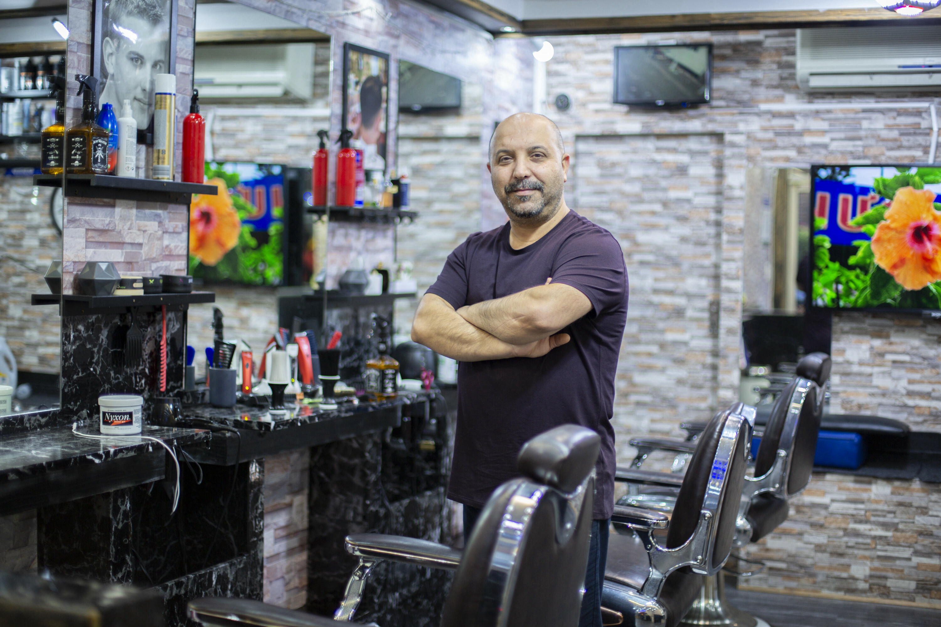 Portraits of migrant shopkeepers living in London