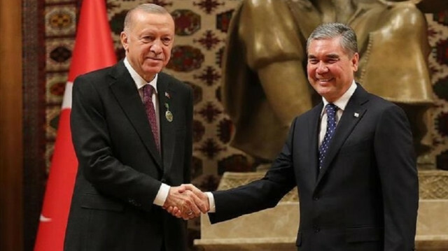 Turkish President Recep Tayyip Erdogan and his Turkmen counterpart Gurbanguly Berdimuhammadow are seen shaking hands