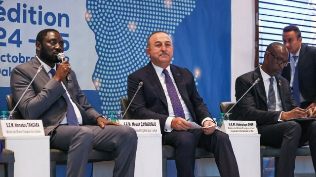 Turkish Foreign Minister Mevlut Cavusoglu (C) attends Dhakar International Forum on October 25, 2022 in Dhakar, Senegal.