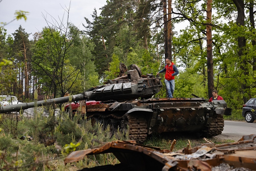 Ukrainians show interest in destroyed military vehicles outside Kyiv
