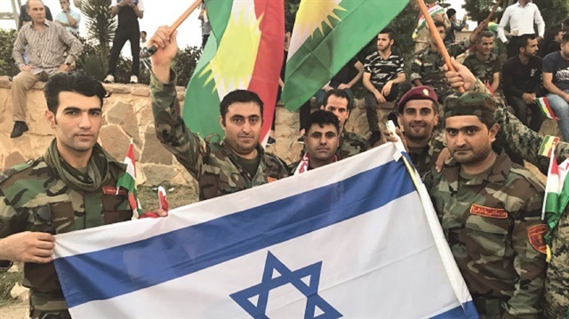 Peshmerga forces were seen waving Israel’s national flags in Erbil on Saturday.