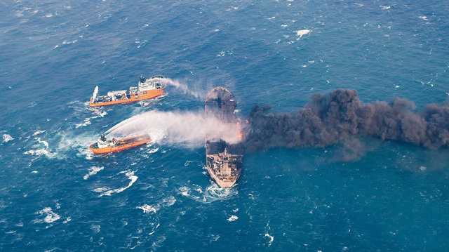 Rescue ships work to extinguish the fire on the Panama-registered Sanchi tanker carrying Iranian oil which went ablaze after a collision with a Chinese freight ship in the East China Sea in this