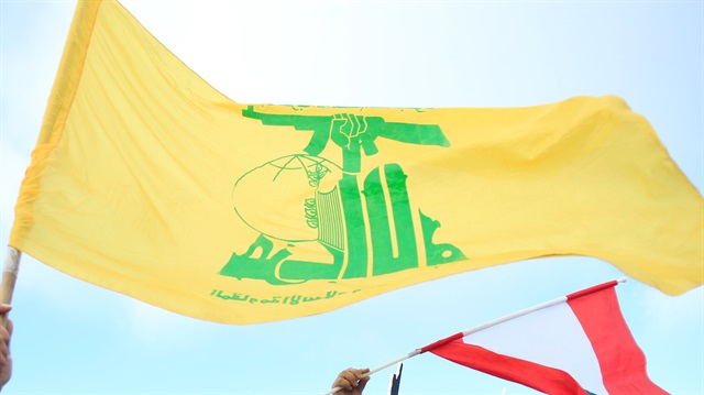 Lebanon's Hezbollah suppoters wave flags