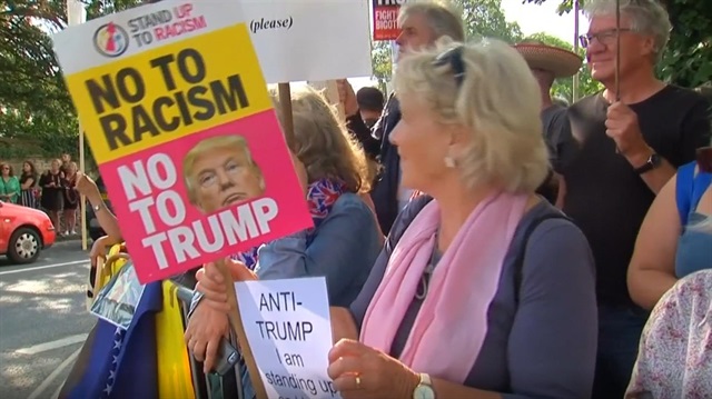 Trump met by wall of protesters outside Blenheim Palace