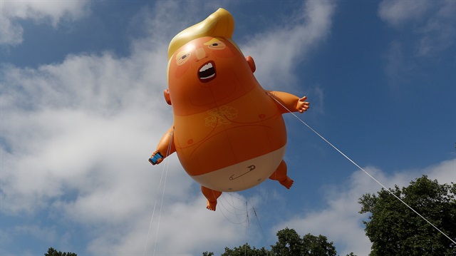 Snarling orange 'Trump baby' blimp flies outside British parliament