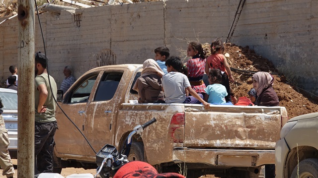 1st convoy of regime opponents leaves Syria’s Daraa