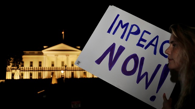 Protesters rally outside the White House in Washington, U.S. on July 16, 2018 after U.S. President Donald Trump's return from Helsinki, Finland.