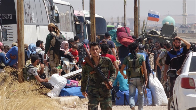 File photo: 1st convoy of regime opponents leaves Syria’s Daraa
