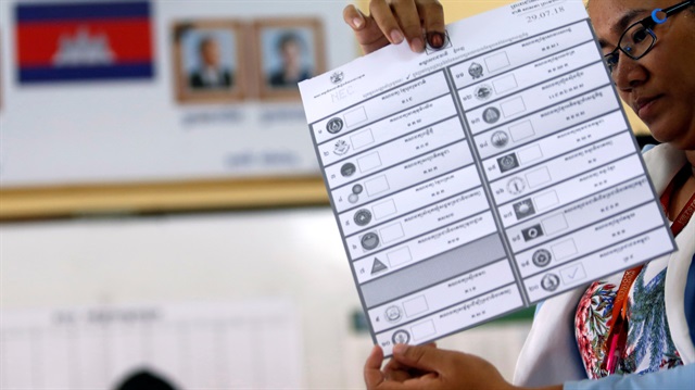 An official starts the process of counting ballots after polls have closed in Cambodia's general election, at a polling station in Phnom Penh, Cambodia July 29, 2018. 