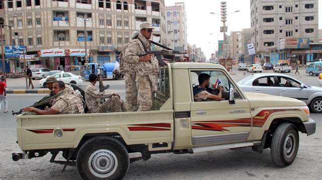 File photo: Yemeni Army soldiers patrol a street in Mansoura District