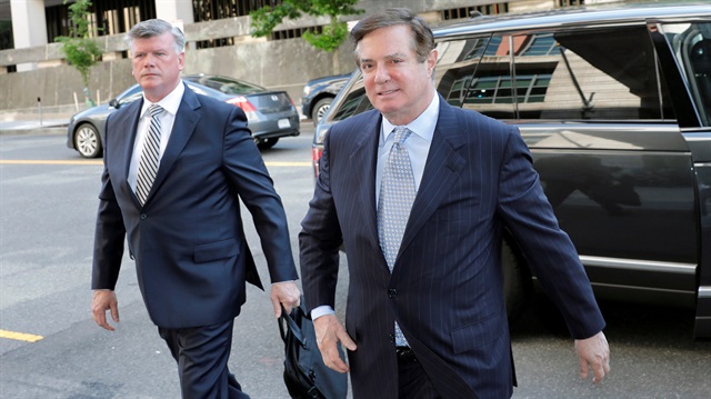 FILE PHOTO: President Trump's former campaign manager Paul Manafort (R) and his attorney Kevin Downing arrive for a motions hearing regarding evidence in his case at U.S. District Court in Washington, U.S.