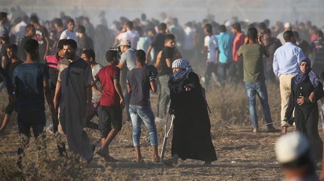 File photo: Palestinian demonstrators gather during a protest at the Israel-Gaza border,
