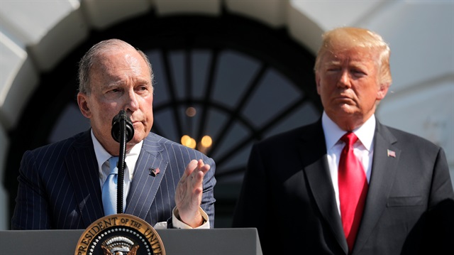 File photo: U.S. President Donald Trump listens as White House economic adviser Larry Kudlow 