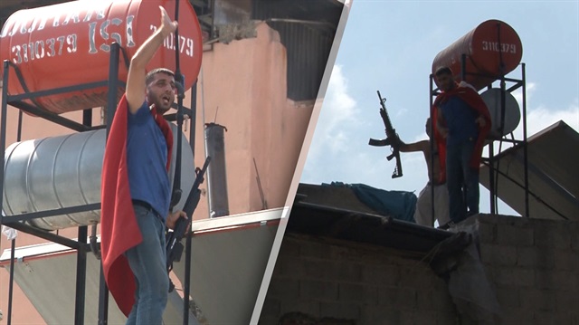 Evlerini yıktırmak istemeyen eylemciler tüfekle çatıya çıktı