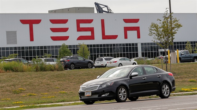 A car passes by the Tesla Inc. Gigafactory 2, which is also known as RiverBend, a joint venture with Panasonic to produce solar panels and roof tiles in Buffalo, New York, U.S., August 2, 2018. 