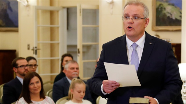 The new Australian Prime Minister Scott Morrison attends a swearing-in ceremony as his wife Jenny looks on, in Canberra, Australia August 24, 2018. 
