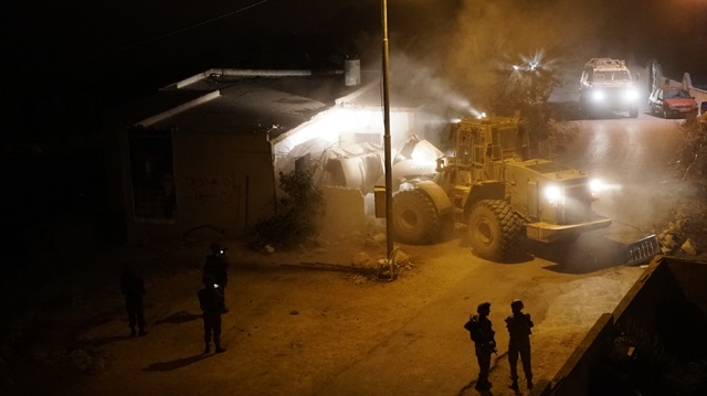 IDF forces demolishing the home of Palestinian Muhammad Yousef in the West Bank village of Kubar on August 28, 2018.  