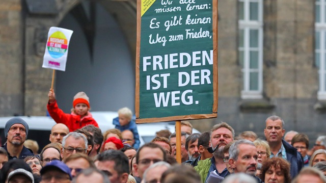 People hold a banner reading: "Peace is the way" as they attend a manifestation following the killing of a German man in Chemnitz, Germany September 2, 2018. 