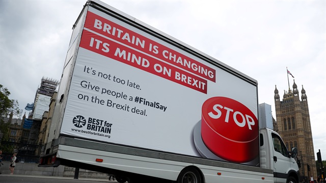A van with a campaign poster about Brexit is driven around Parliament Square in London