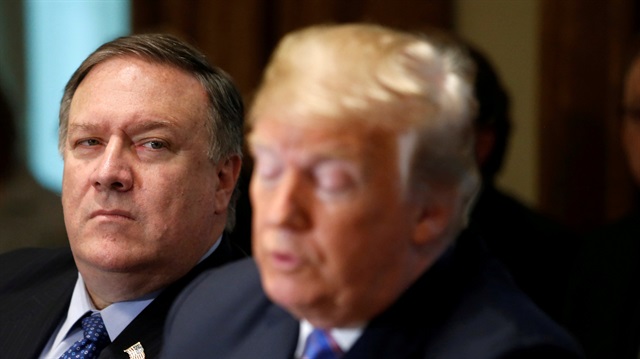 U.S. Secretary of State Mike Pompeo listens as President Donald Trump