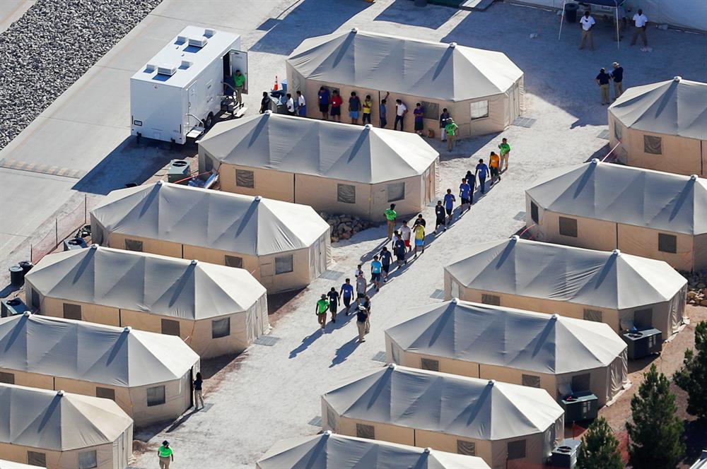 File photo: Immigrant children now housed in a tent encampment under the new 