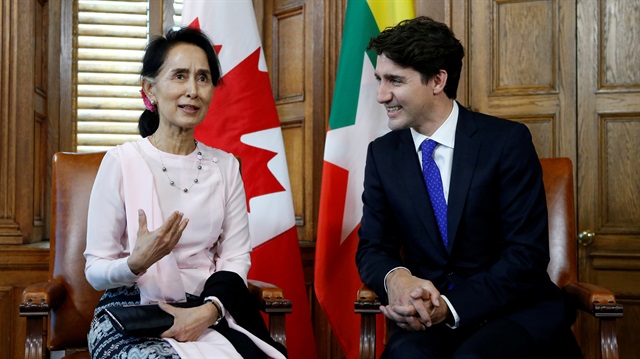 File photo: Canada's Prime Minister Justin Trudeau (R) listens to Myanmar State Counsellor Aung San Suu Kyi speak during a meeting in Trudeau's office on Parliament Hill in Ottawa, Ontario, Canada, 