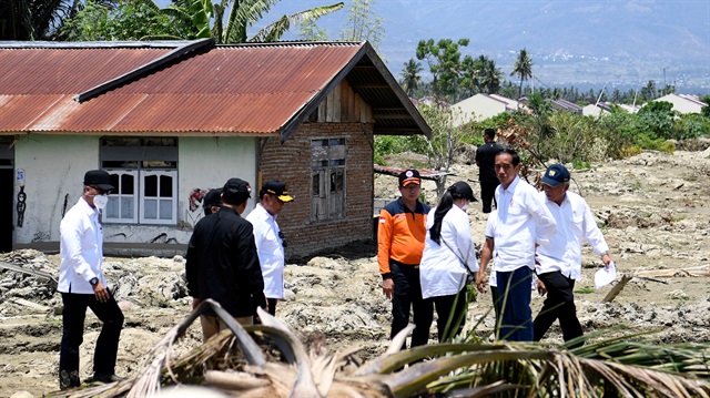 Indonesian President Joko Widodo visits an area affected by an earthquake at Petobo district, Palu, Central Sulawesi