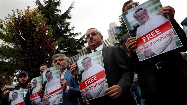 Human rights activists and friends of Saudi journalist Jamal Khashoggi hold his pictures during a protest outside the Saudi Consulate in Istanbul, Turkey October 8, 2018.