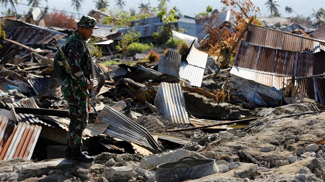 A soldier stands in an area destroyed by an earthquake and liquefaction in the Petabo neighbourhood in Palu, Central Sulawesi, Indonesia, October 8, 2018.