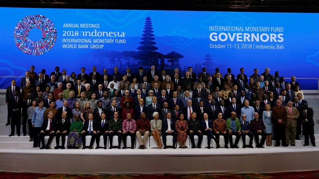 International Monetary and Financial Committee pledged to refrain from competitive currency devaluations and step up dialogue on trade