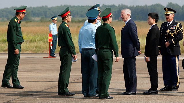 U.S. Secretary of Defense Jim Mattis (3rd R) talks with Vietnamese military officials while he visits Bien Hoa airbase, where the U.S. army stored the defoliant Agent Orange during the Vietnam War, in Bien Hoa city, outside Ho Chi Minh City, Vietnam October 17, 2018. 