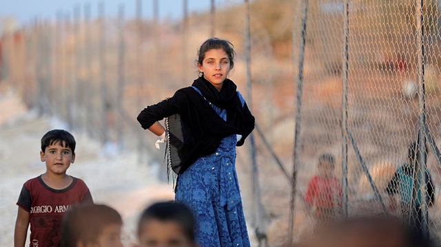 Displaced Syrian children arrive at a refugee camp in Atimah village, Idlib province, Syria September 11, 2018. 