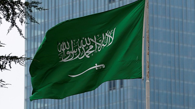 A Saudi flag flutters atop Saudi Arabia's consulate in Istanbul, Turkey.