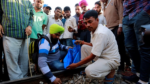 A large crowd had formed near the tracks on the city's fringe for the burning of effigies as part of a major Hindu festival on Friday when the train sped through the gathering in darkness