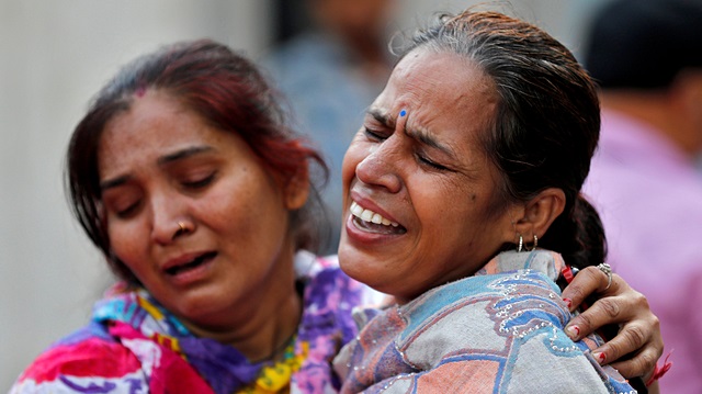 Women mourn the death of a relative after railway accident on Friday
