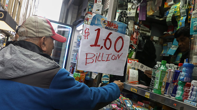 File photo:A man buys tickets for Tuesday's Mega Millions lottery drawing after the jackpot exceeded $1.6 billion in New York City, New York, U.S., October 23, 2018