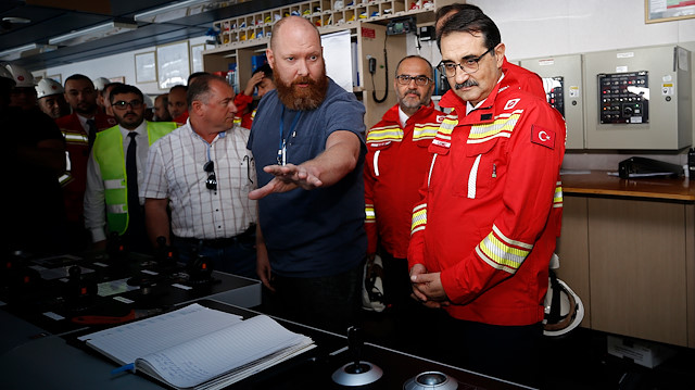 Turkish Energy and Natural Resources Minister Fatih Donmez poses for a photo as he visits to inspect the Fatih Drill Ship before it starts to operate.