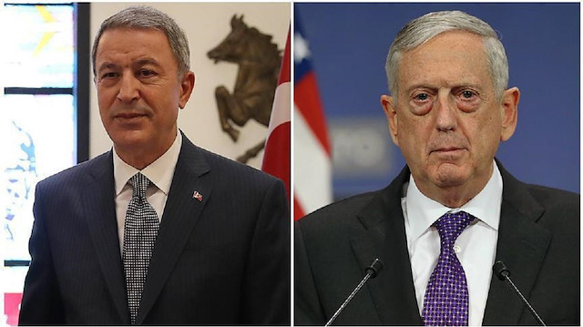 Turkey's Defence Minister Hulusi Akar talks with U.S. Secretary of Defense Jim Mattis 