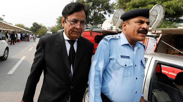 Saiful Mulook (L) the lawyer of Christian woman sentenced to death for blasphemy against Islam, leaves after the Court overturned the conviction, in Islamabad, Pakistan October 31, 2018. 