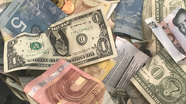 Dollar firm, sterling gives up gains after touching two-week high