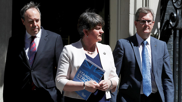 Democratic Unionist Party (DUP) Leader Arlene Foster, alongside Deputy Leader Nigel Dodds and Chief Whip Jeffrey Donaldson, leave 10 Downing Street, in central London, Britain June 26, 2017. 