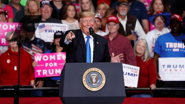 File photo: U.S. President Donald Trump points towards the crowd 