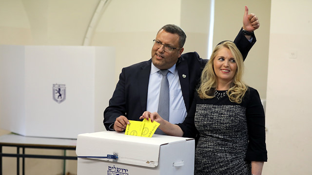 Jerusalem mayoral candidate Moshe Lion and his wife cast their votes in the second round of local council elections in Jerusalem November 13, 2018. 