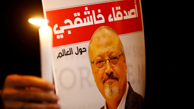  A demonstrator holds a poster with a picture of Saudi journalist Jamal Khashoggi