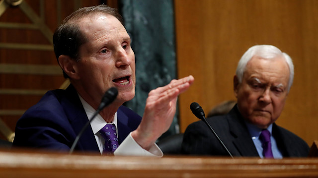 Senator Ron Wyden, L, (D-OR) questions Commerce Secretary Wilbur Ross 