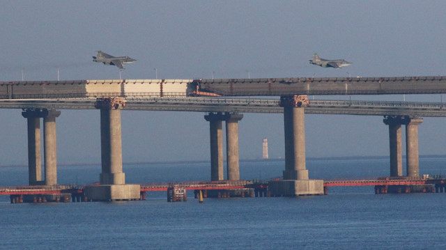 Russian jet fighters fly over a bridge connecting the Russian mainland with the Crimean Peninsula after three Ukrainian navy vessels were stopped by Russia from entering the Sea of Azov via the Kerch Strait in the Black Sea, Crimea.