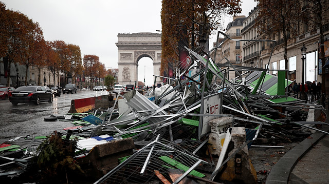 A barricade lays on the side at the Champs-Elysees avenue in the aftermath of a rally by yellow vests protesters against higher fuel prices in Paris, France.