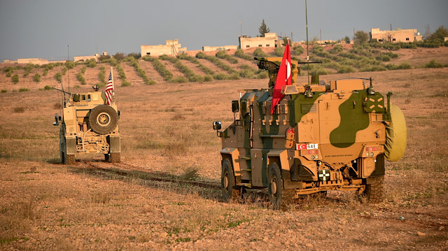 Turkish and U.S. troops are pictured during a joint patrol in Manbij area, northern Syria November 8, 2018. 