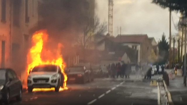 Car burns in Paris as high-school students protest